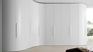 Угловой шкаф в современном стиле с радиусными фасадами.